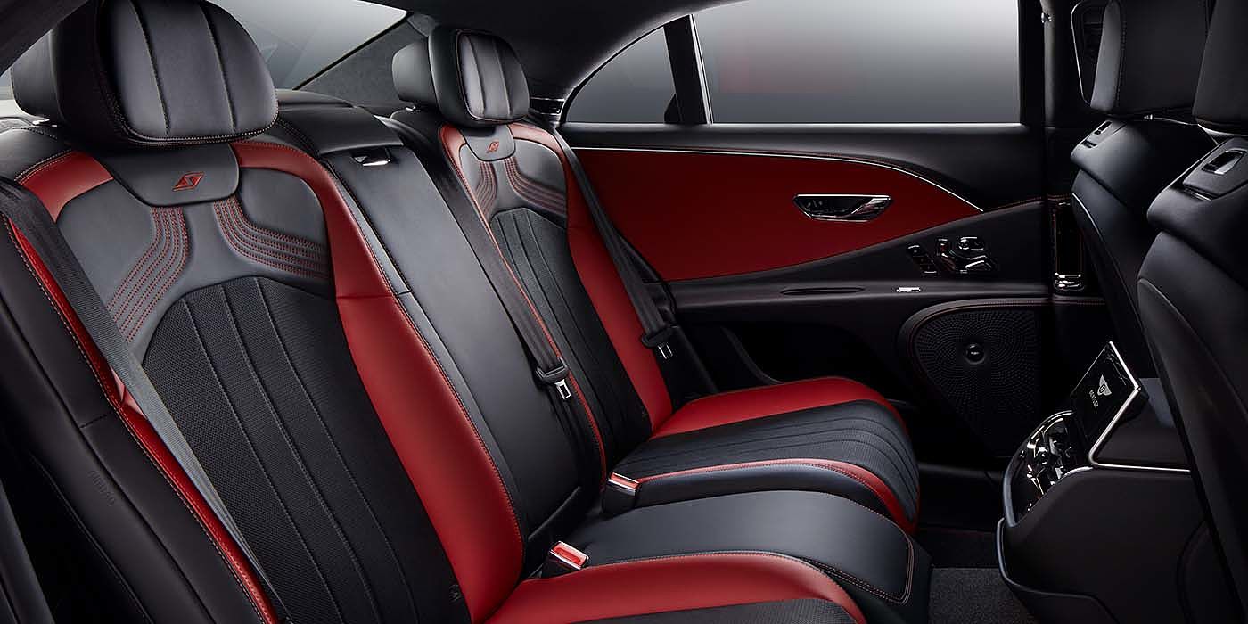 Bentley Cambridge Bentley Flying Spur S sedan rear interior in Beluga black and Hotspur red hide with S stitching