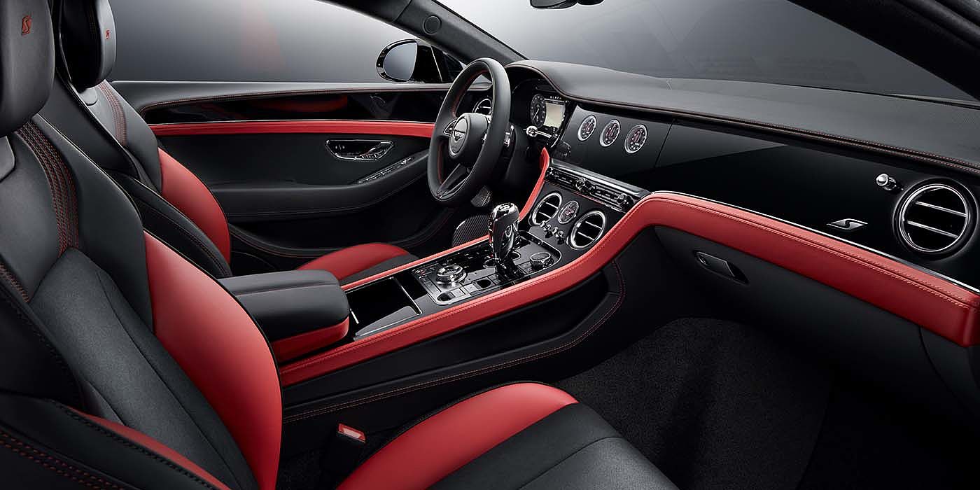 Bentley Cambridge Bentley Continental GT S coupe front interior in Beluga black and Hotspur red hide with high gloss Carbon Fibre veneer